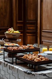 a buffet with several trays of food on a table at Cowley Manor Experimental in Cheltenham