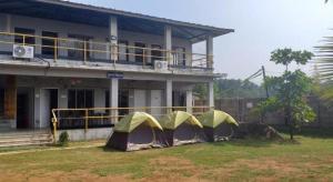 a group of tents in front of a house at SAMARA SEAVIEW in Alibag