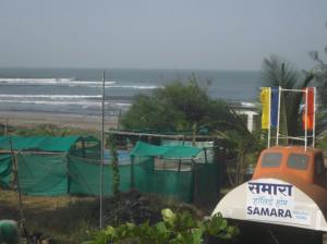 a beach with a tent and the ocean at SAMARA SEAVIEW in Alibag
