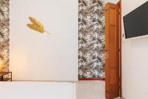 a room with a butterfly on the wall at Duomo - Citylife Pink Vintage APT center Milan in Milan