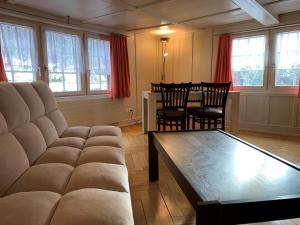 a living room with a couch and a table at Revier lauschig und charmant in Dornhaus