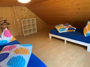 a room with two beds in a attic at Revier Bliili und Spitzer in Diesbach