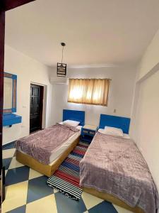 Ένα ή περισσότερα κρεβάτια σε δωμάτιο στο Dahab Vibes Hotel