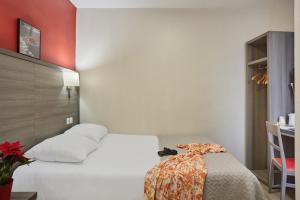 Postel nebo postele na pokoji v ubytování Huni Hôtel