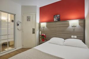 Postel nebo postele na pokoji v ubytování Huni Hôtel
