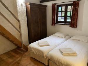 Posteľ alebo postele v izbe v ubytovaní Cosy former bakery house with communal swimming pool