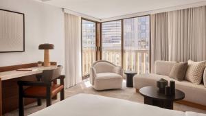 a hotel room with a bed and a desk at The Jay, Autograph Collection in San Francisco