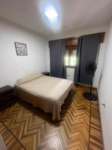 Кровать или кровати в номере Vistas del Cerro - 2 Dormitorios - Zona Centro