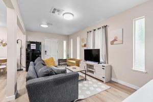 a living room with a couch and a tv at 1 Bedroom Apt near Santana Row, recently remodeled in San Jose