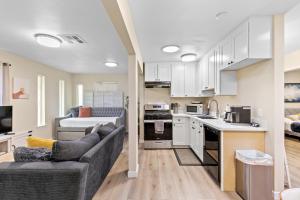 a living room with a couch and a kitchen at 1 Bedroom Apt near Santana Row, recently remodeled in San Jose