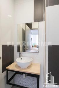 a bathroom with a white sink and a mirror at 1-5 Guests, Spacious & Comfy Duplex-Studio, Empire City Damansara by Flexihome-MY in Petaling Jaya +76 photos