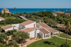 an aerial view of a house with the ocean in the background at Villa Angelica with private access to Nora beach in Pula