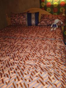 Кровать или кровати в номере Munyana homestay