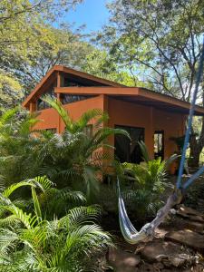 a small house in the middle of a forest at Aldos place in Playa Negra