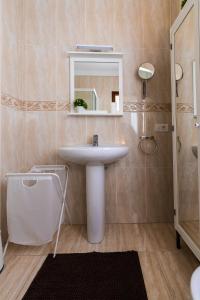 a bathroom with a sink and a mirror at Casa Nana - Playa Santiago in Playa de Santiago +16 photos