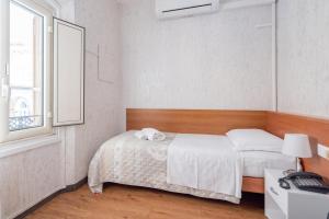 Postel nebo postele na pokoji v ubytování Hotel Donatello