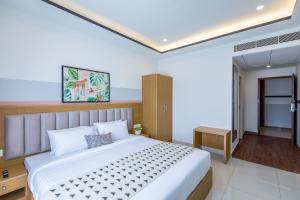 a bedroom with a large bed in a room at Olive Hebbal - by Embassy Group in Bangalore