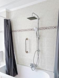 a shower in a bathroom with a tub at Haus Neuss-1.OG in Neuss