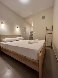 Postel nebo postele na pokoji v ubytování Tassos Cottage Fiskardo