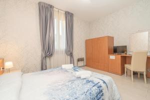 Postel nebo postele na pokoji v ubytování Hotel Donatello