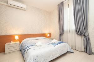 Postel nebo postele na pokoji v ubytování Hotel Donatello