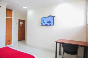 Televiisor ja/või meelelahutuskeskus majutusasutuses Hotel Murali - Cerca del Aeropuerto de Guayaquil