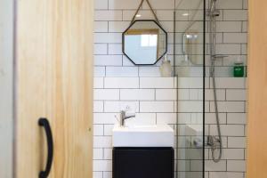 a bathroom with a sink and a mirror at Boho 03 Bohemian Studio in Mar Mikhael Eartha in Beirut