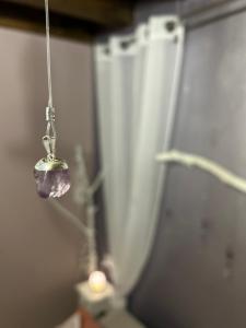 a bead hanging from a string in a room at B&B Cristalli Di Luce in Albavilla