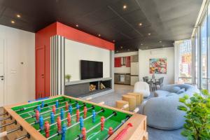 a living room with a pool table in the middle at The Club 1-Bedroom Apartment in Gemmayze in Beirut