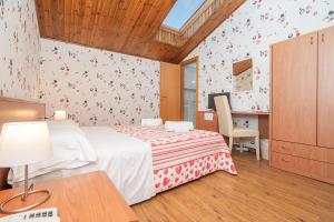 Postel nebo postele na pokoji v ubytování Hotel Donatello
