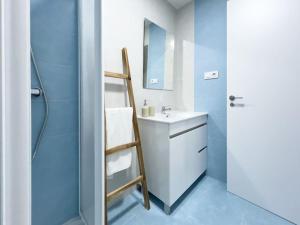 a bathroom with a ladder next to a sink at Apartamentos Gredos 203 in Jaraiz de la Vera +15 photos