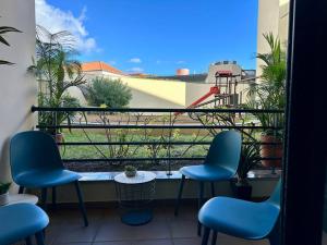 a balcony with chairs and a table and a view at SUPER Anadia - Turquesa in Funchal