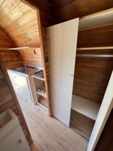an empty closet in a tiny house at Floripa Glamping in Florianópolis
