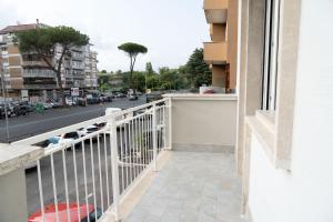 a balcony with a view of a city street at Discover Sustainable Bliss: 2-BR Apartment in Rome in Rome