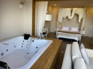 A bed or beds in a room at Alya Villa Butik Hotel