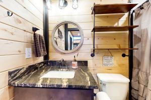 a bathroom with a sink and a toilet at Fiesta Hills Hideaway in Sevierville +29 photos