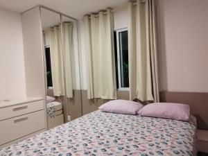 Tempat tidur dalam kamar di RESORT PALM VILLAGE - Muro ALTO, Porto DE GALINHAS
