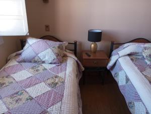 Llit o llits en una habitació de Hostal Tierra de Pehuen