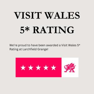 a flag with the words visit wales rating and the words were at Larchfield Grange, Luxury House with Stunning Views in Abergavenny