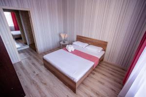 Una cama o camas en una habitación de 2-ком Костанай Плаза, Тобол Арена, Allur auto, заводы, Береке