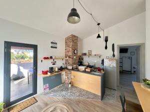 a kitchen with a counter in a room at Civico36 in Ilbono