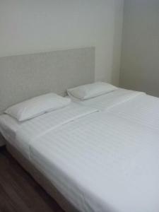 1ACS Residence客房内的一张或多张床位