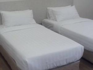 1ACS Residence客房内的一张或多张床位