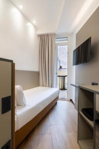 TV a/nebo společenská místnost v ubytování London Hotel