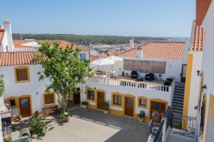 a view of the town from the balcony of a house at Sol da Vila in Vila Nova de Milfontes
