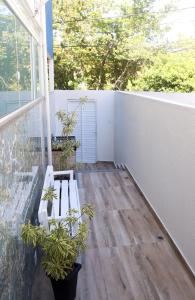 Uma varanda ou terraço em Reduto Praiano - Thaiz Hospedagem
