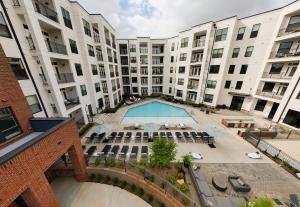 an overhead view of an apartment complex with a pool at Mint House Greenville - West End in Greenville