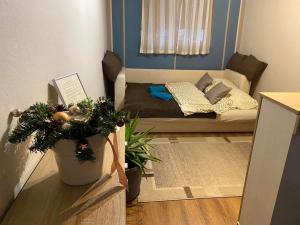 a small living room with a couch in a room at LURKÓ Apartmanok Siófok in Siófok +48 photos