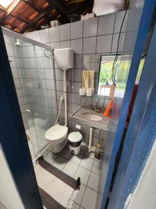 a small bathroom with a toilet and a sink at Serra do Matias in Maranguape