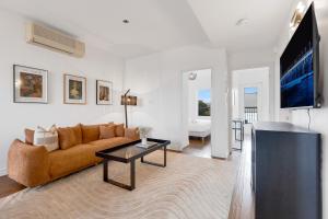 a living room with a couch and a table at Lofts de la petite Italie in Montréal